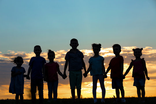 little kids holding hands