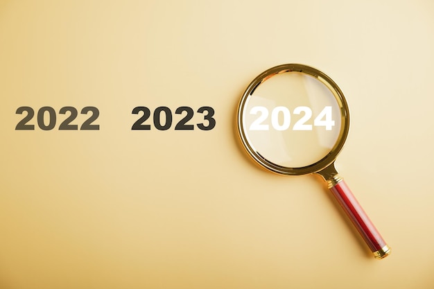 Premium Photo | A magnifier highlights the 2024 icon representing ...