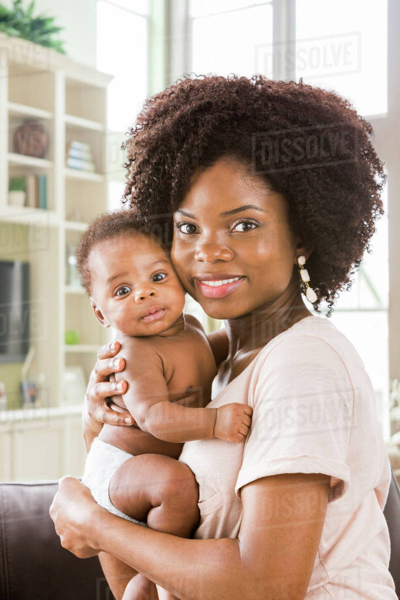 mom holding baby