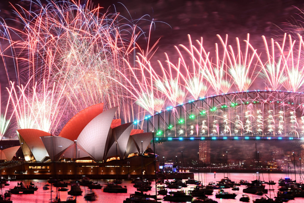 New Years Eve celebrations sweep around the world, but wars cast ...