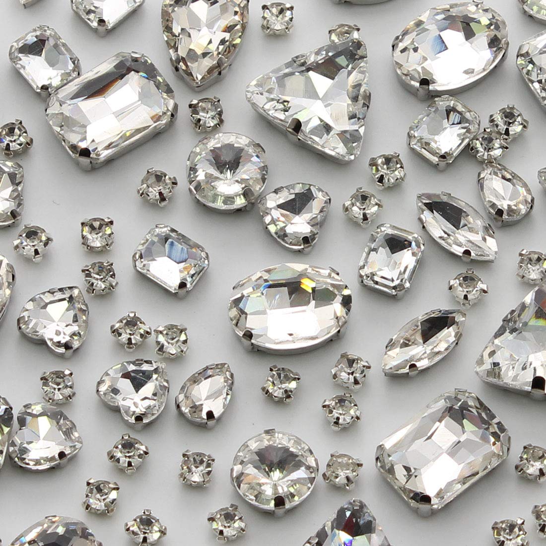 TANOSII 100 Pieces Mixed Shape Glass Rhinestones Sew On Crystal Rhinestones  Flat Back with Silver Claw for Jewelry Crafts Clothes White : Amazon.de: ...