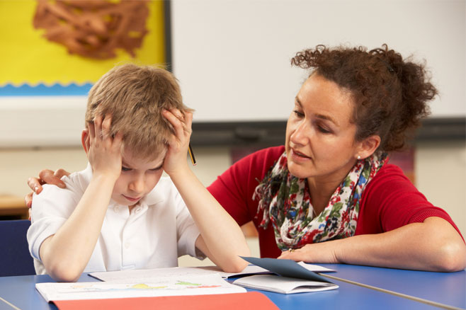 teacher helping student