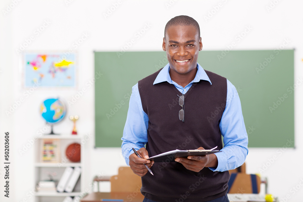 male teacher holding a clipboard Stock-Foto | Adobe Stock