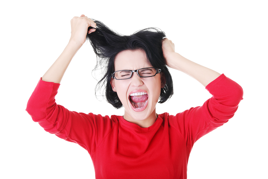 woman pulling her hair out