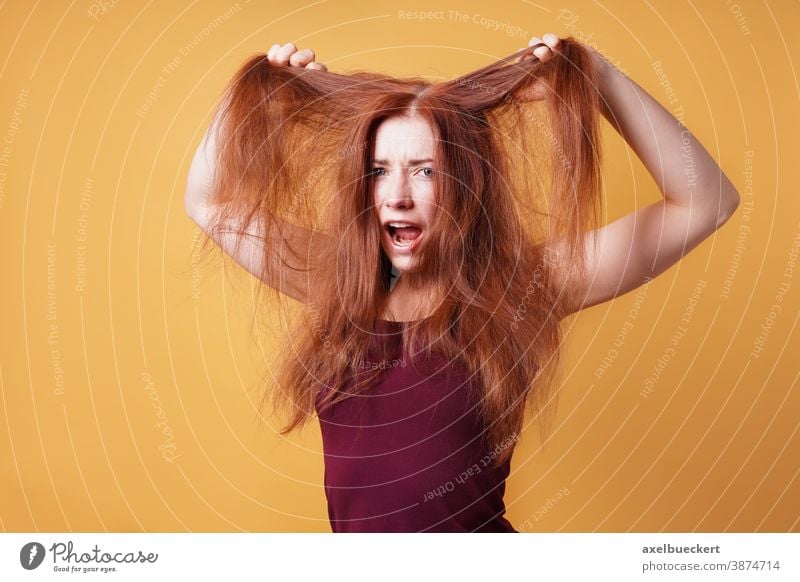 woman pulling her hair out
