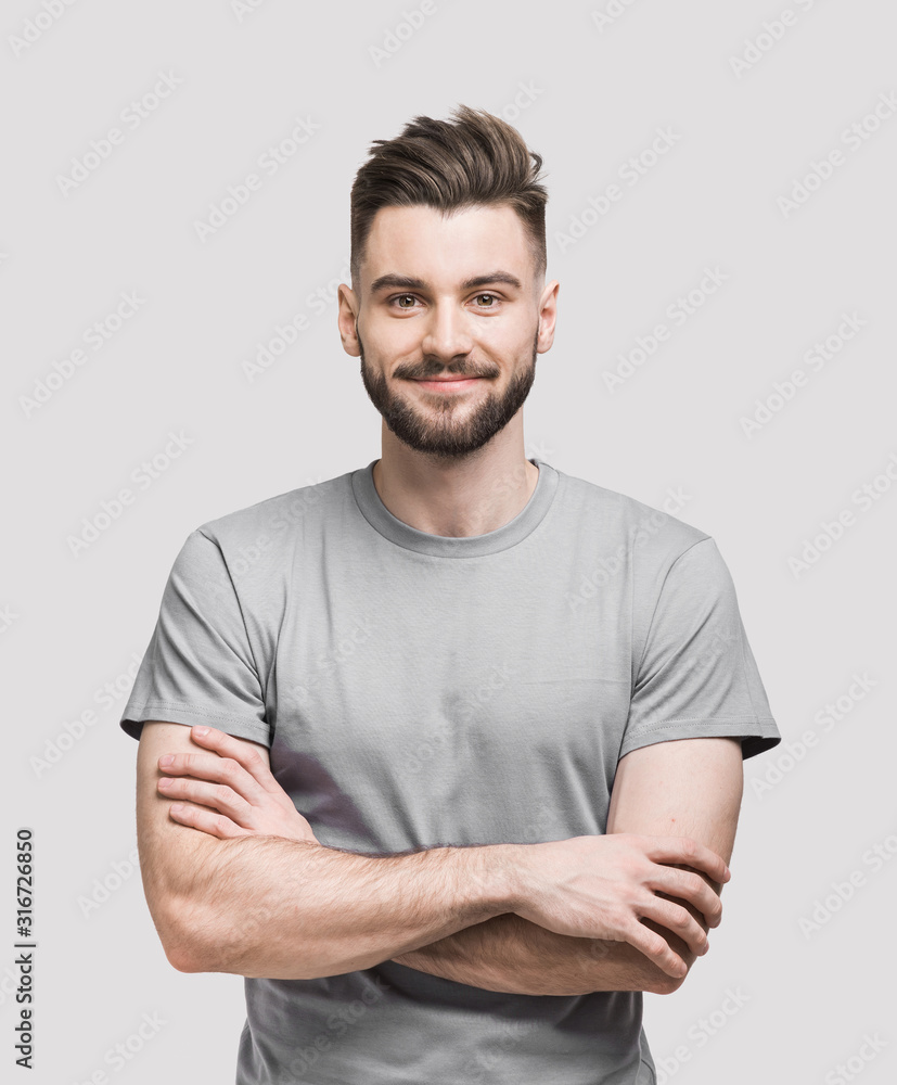 Portrait of handsome smiling young man with folded arms, kite_rin ...