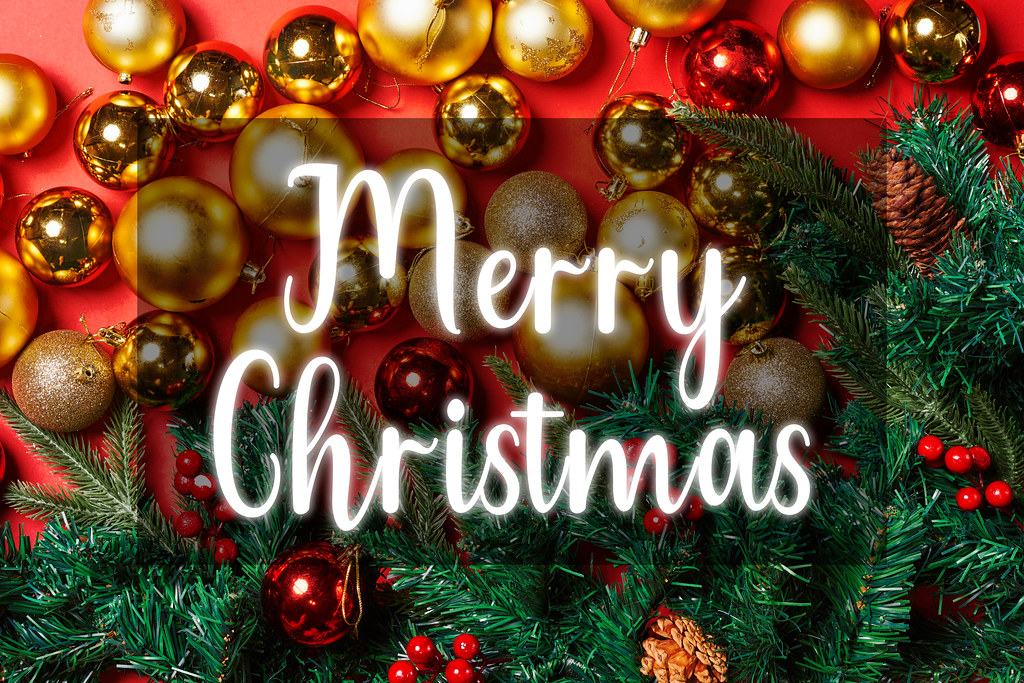 Festive Merry Christmas Greeting with Gold Ornaments and Pine