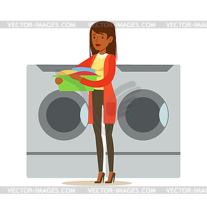 cute boy throwing dirty laundry into the washing machine 14831207 