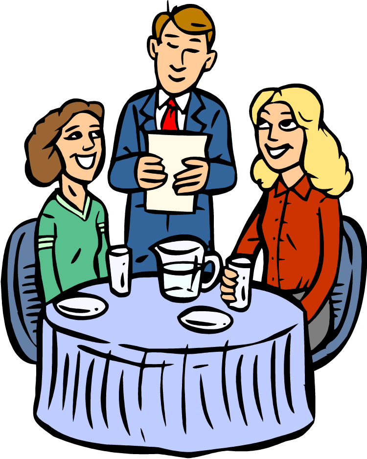 A smiling waiter presents a menu to two happy customers seated at a restaurant table with water and plates.