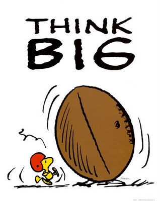 Woodstock pushing a giant acorn with "THINK BIG" text above.