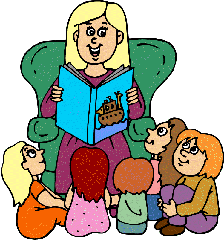 A smiling woman reads a storybook to a group of five children sitting on the floor around her in a cozy green armchair.