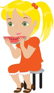 A cheerful blonde girl in an orange dress sits on a stool eating a slice of watermelon.