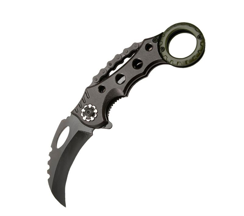 Black tactical karambit knife with olive green ring handle and chain-link guard, isolated on white background.