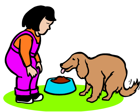 A child in purple overalls feeds a brown dog from a blue bowl on green grass.