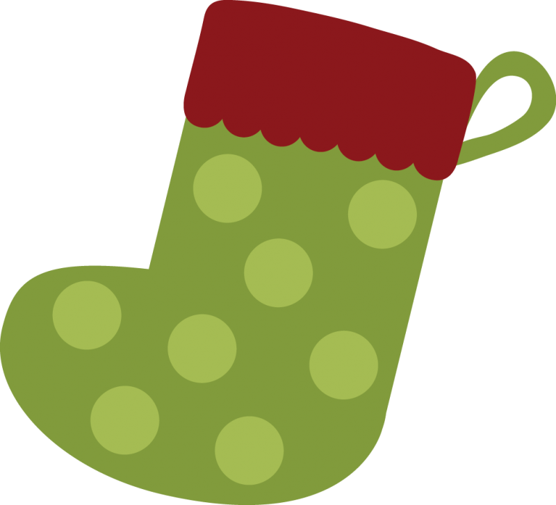 Green Christmas stocking with light polka dots and red scalloped cuff, isolated on white background.