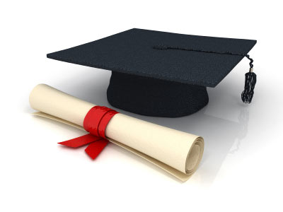 Black graduation cap with tassel beside a rolled diploma tied with red ribbon on white background.