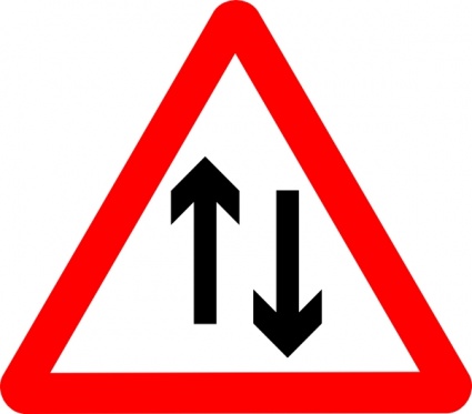Red triangular warning sign showing opposing upward and downward arrows indicating two-way traffic ahead.