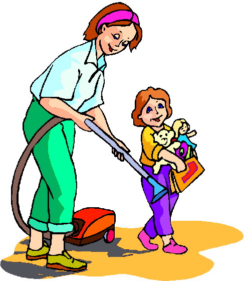 A woman vacuuming a spill while a smiling child holds toys and a bag nearby.