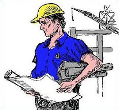 Construction worker in yellow hard hat reviewing blueprints at a job site with crane in background.