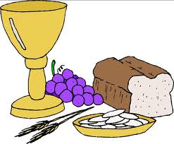 Golden chalice, purple grapes, loaf of bread, wheat stalks, and communion wafers symbolizing Christian Eucharist.