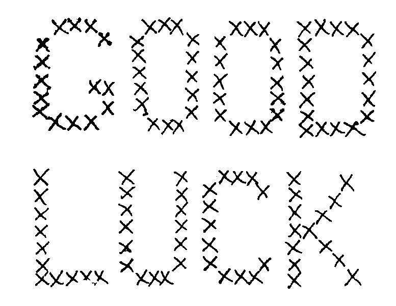 "GOOD LUCK" spelled out in hand-stitched cross-stitch pattern on white fabric background.