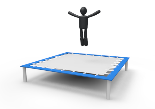 Black stick figure joyfully jumping on a blue-framed trampoline against white background.