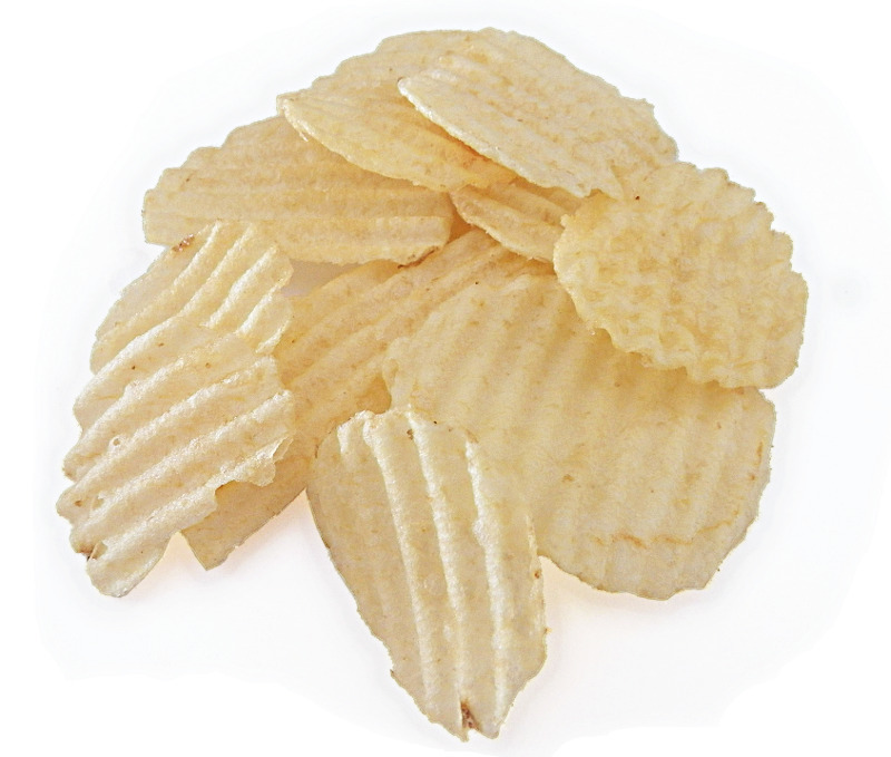 Golden ridged potato chips piled on a white background, crispy and lightly salted.