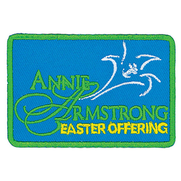 Embroidered patch for Annie Armstrong Easter Offering with dove and green/blue design.