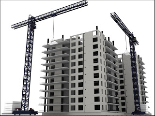 Two construction cranes lifting materials at a multi-story concrete building site under development.