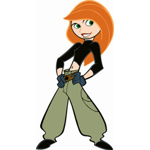Kim Possible, animated teenage heroine with orange hair, black top, green cargo pants, and utility belt, standing confidently.