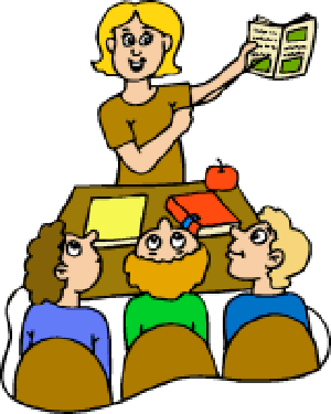 A smiling teacher holds up a book while three students sit at a desk with books and an apple, illustrating a classroom reading session.