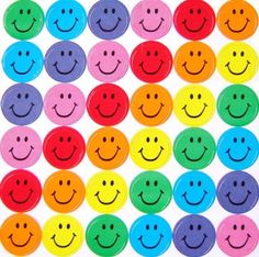 Grid of colorful circular smiley face stickers in rainbow hues arranged neatly on white background.