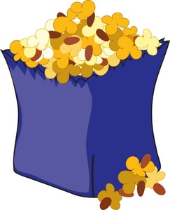A blue paper bag overflowing with yellow and brown popcorn kernels, some spilling onto the surface below.
