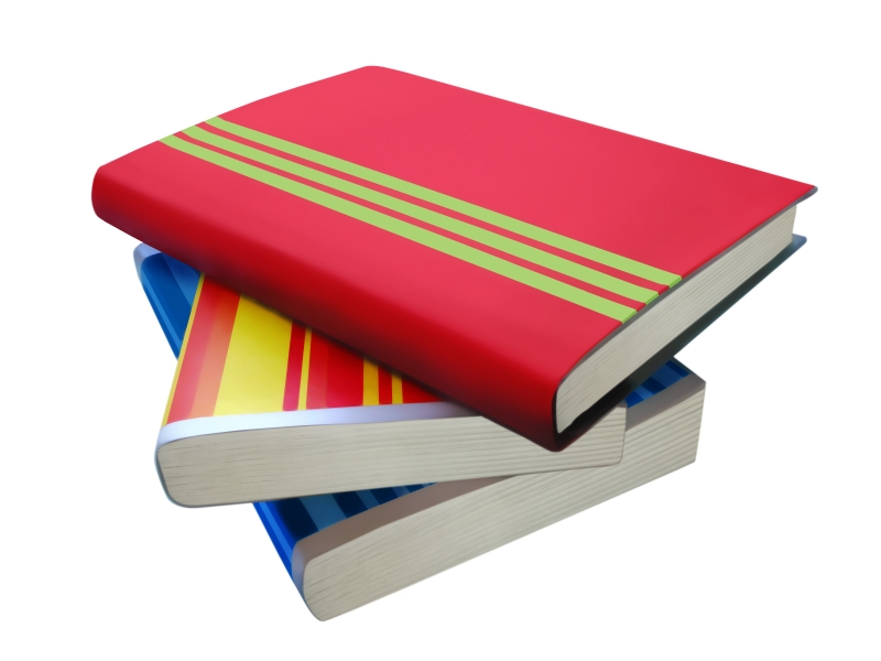 Stack of three colorful hardcover books with red, yellow, and blue covers on white background.