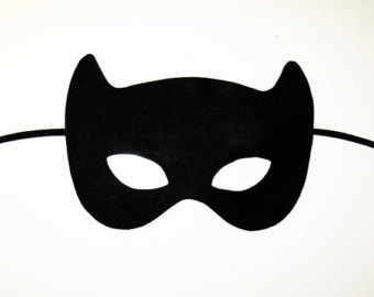 Black felt cat-ear mask with eye cutouts and elastic strap, isolated on white background.