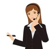 Professional woman in business attire using a headset and holding a pen, illustrating customer support or call center service.