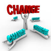 A 3D figure lifts a red "CHANGE" sign while surrounded by fallen blue "CHANGE" signs, symbolizing transformation and decision-making.