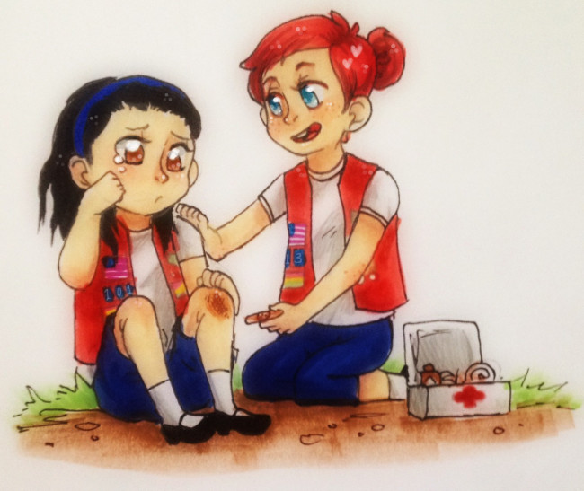 A red-haired scout comforts a crying girl with a scraped knee while applying first aid from a kit.