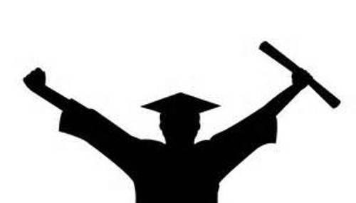 Silhouette of a graduate celebrating with arms raised, holding a diploma and wearing a cap and gown.