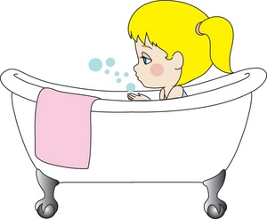 A cartoon girl with blonde hair in a ponytail sits in a white clawfoot bathtub, blowing bubbles, with a pink towel draped over the side.