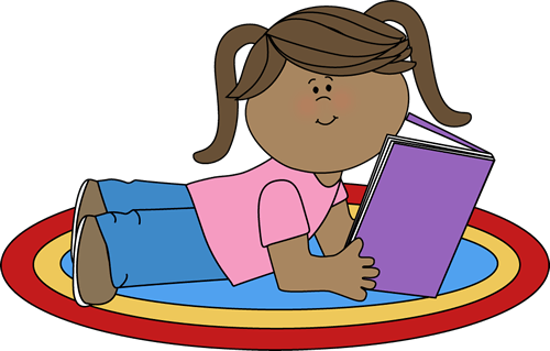 A young girl with pigtails lies on a colorful rug reading a purple book.