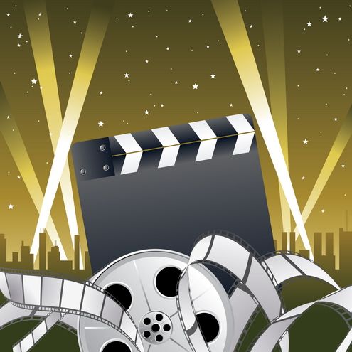 Film Production Essentials - Clapperboard & Reels in Cinematic Spotlight