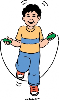 Smiling boy in yellow shirt and blue pants jumping rope with green handles.