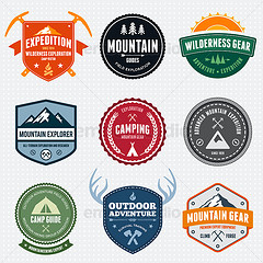 Collection of nine vintage-style outdoor adventure and camping badge designs in various shapes and colors.