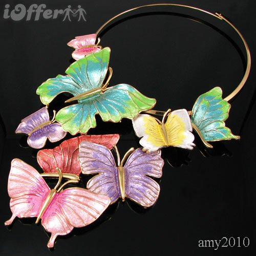 Colorful enamel butterfly necklace with gold-tone metal on black background