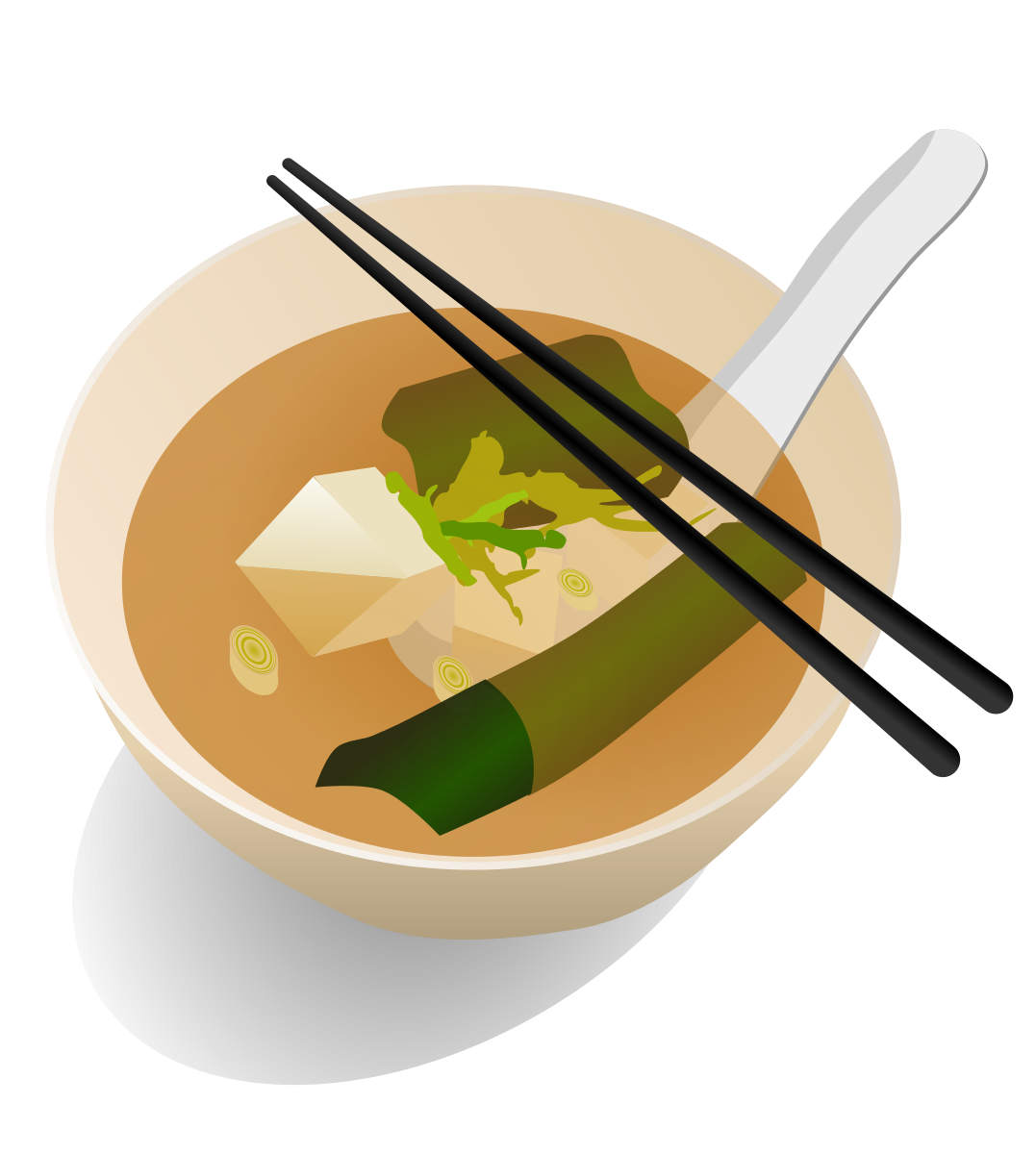 A bowl of miso soup with tofu, green onions, wakame seaweed, and a spoon and chopsticks resting on top.