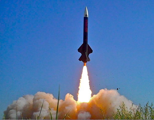 Rocket Launch in Clear Blue Sky - High-Resolution Image