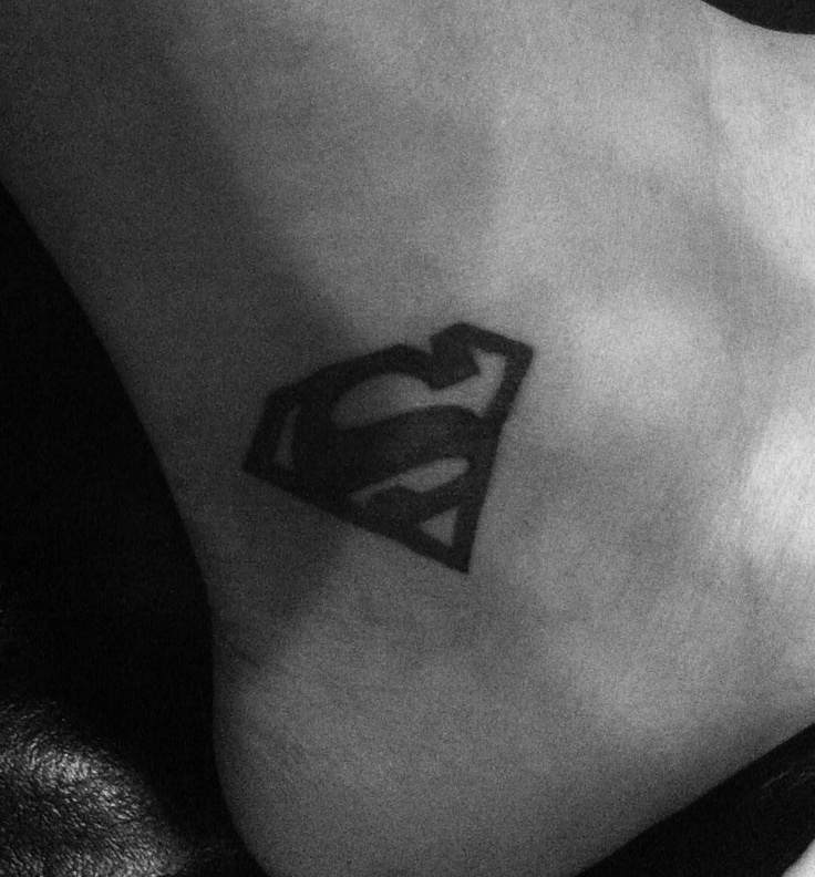 Nordic style superman logo tattoo idea | TattoosAI