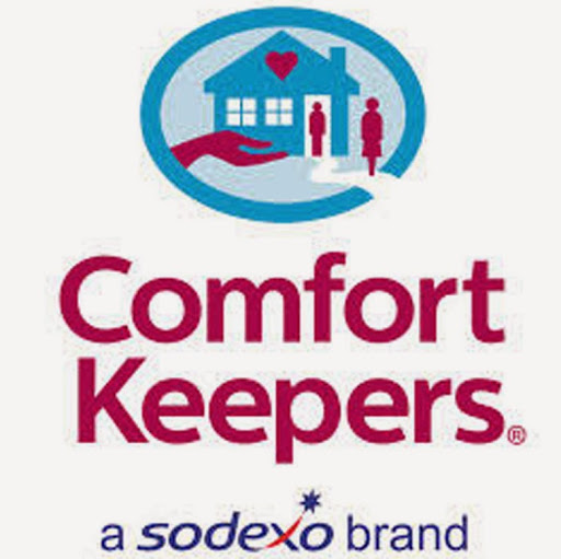 Comfort Keepers logo featuring a blue house with a heart, two figures, and a supportive hand, under the brand name in maroon.