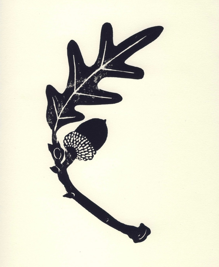 Black ink linocut print of an oak leaf and acorn on a light cream background, showcasing detailed veining and textured cap.